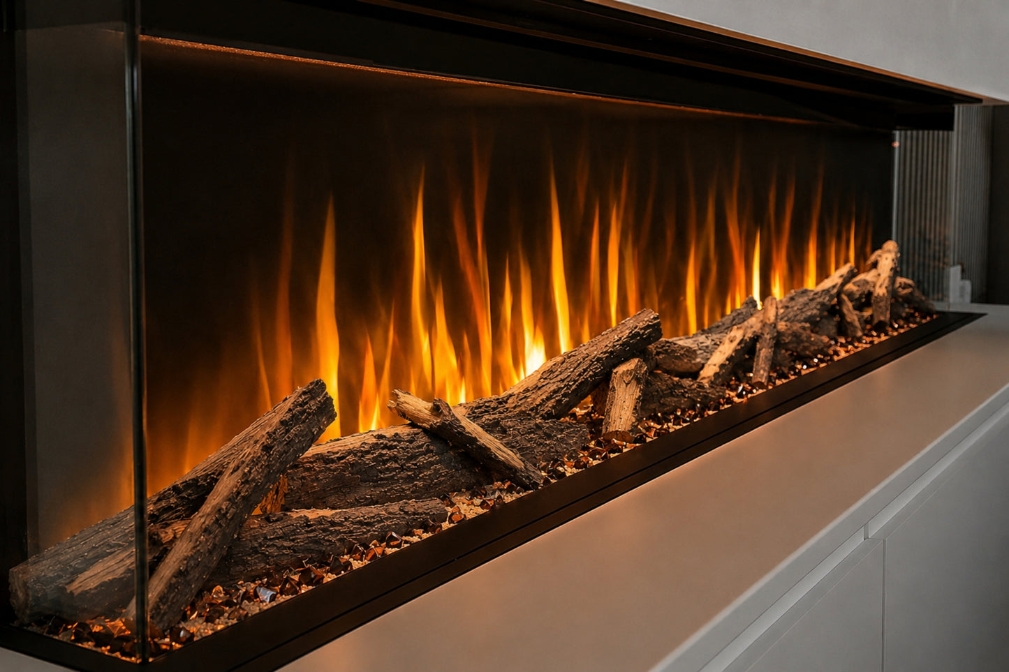Advance Series electric fireplace angled close-up showing realistic Woodland logs, glowing fuel bed and panoramic orange flame effect from Evolution Fires.